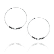 Zilveren oorringen met tribaal motief